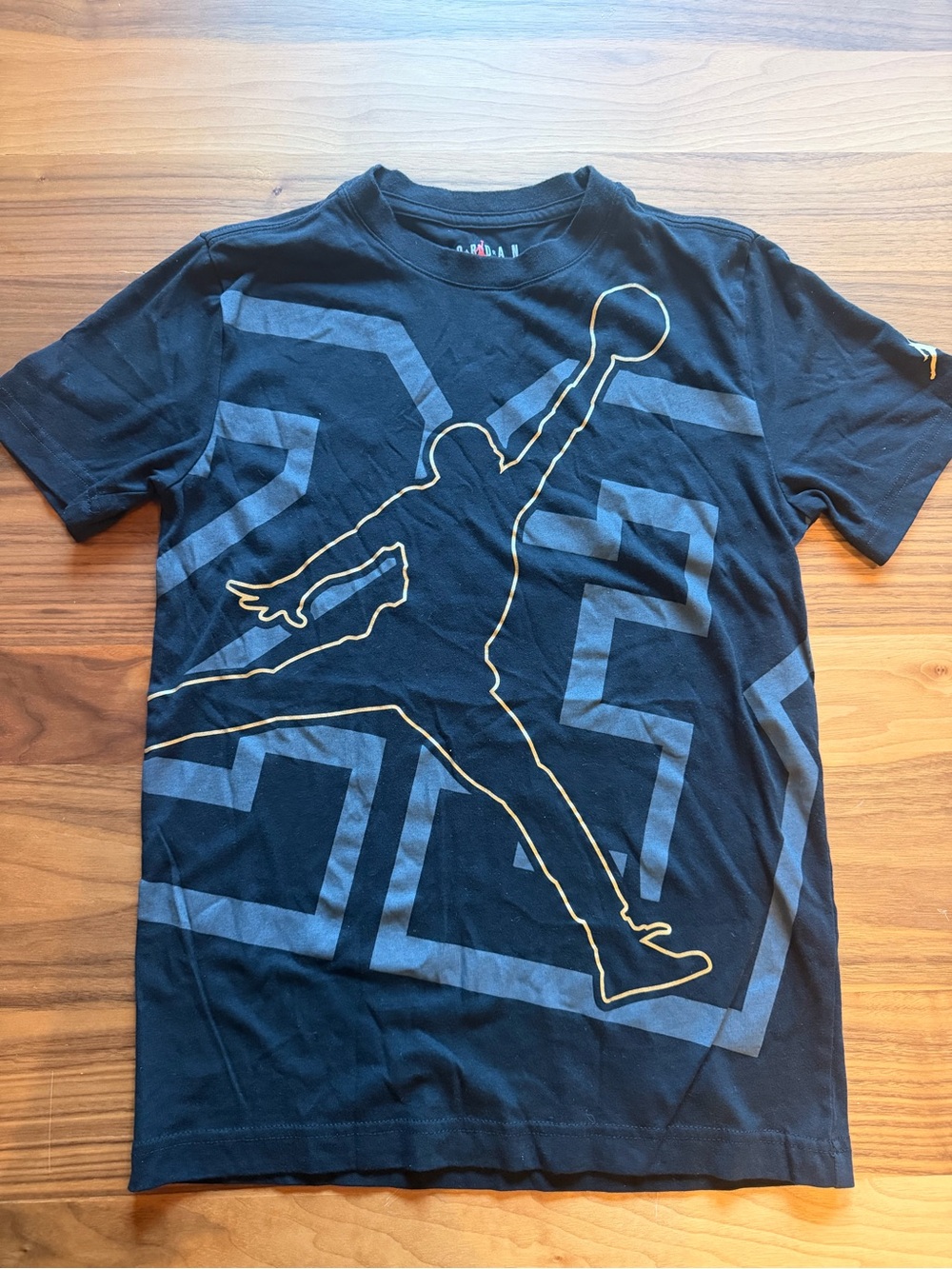 Nike Kis’s Black T-Shirt with Gold-Outlined Jumpman Graphic